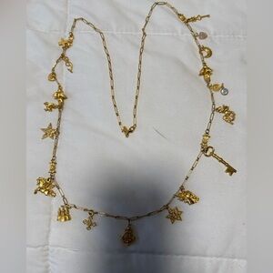 KIRK FOLLY Gold Tone fantasy Charm Necklace. 42” adjustable paper clip chain.